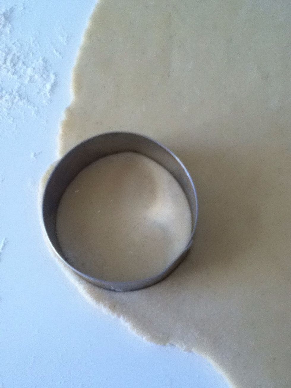 Find a round cake tin or a round glass you can poke the cakes out with :)