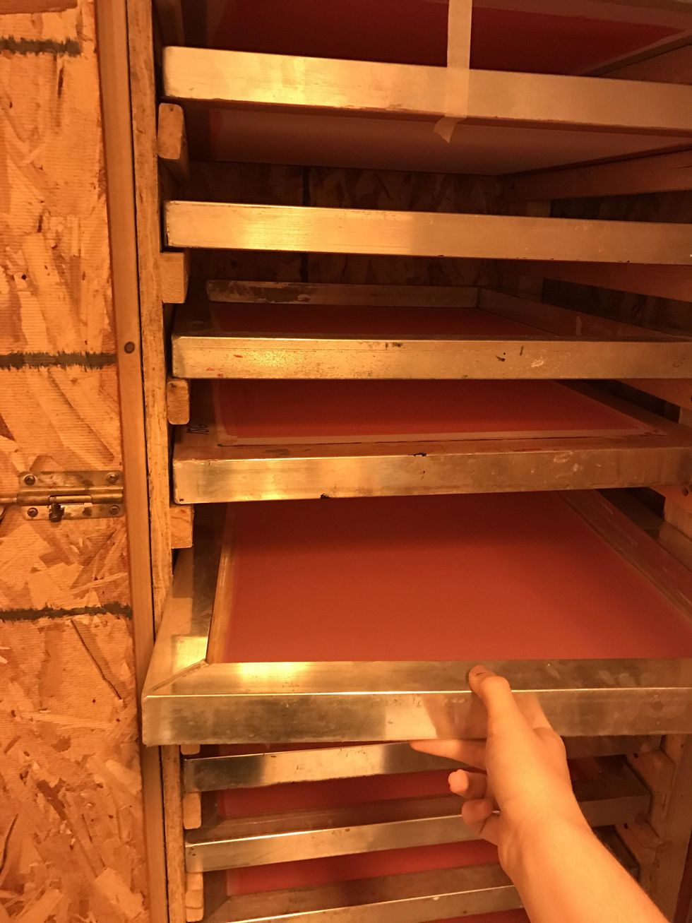 Find a screen with emulsion on it that is smooth and even. Pick between either a 110 screen which is used for more simple designs or a 156 screen which is used for more detail designs.