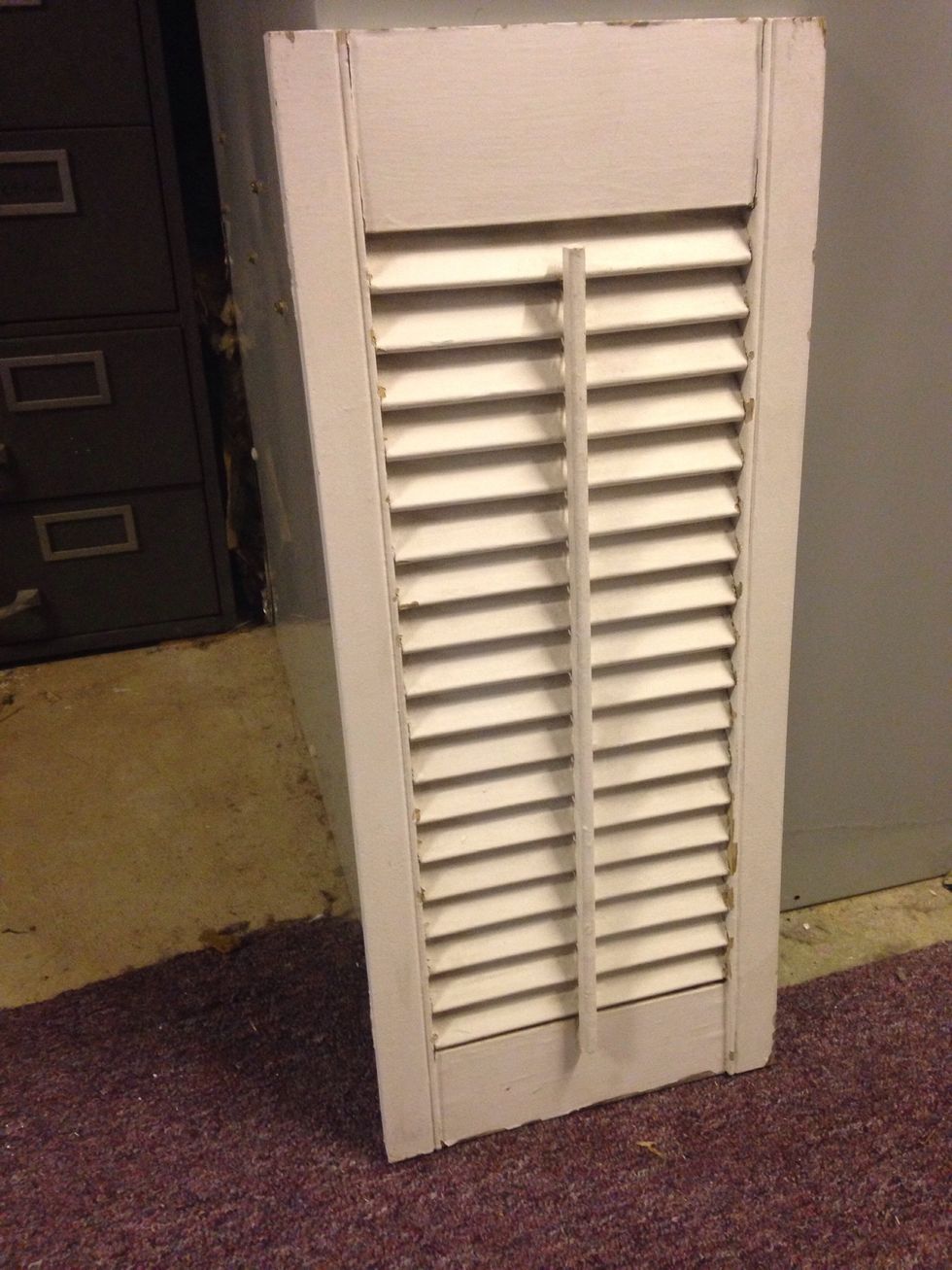 Find a shutter, approximately 2 feet tall, 8 inches wide, and get it ready to prime. (Wash it, sand it, etc.)