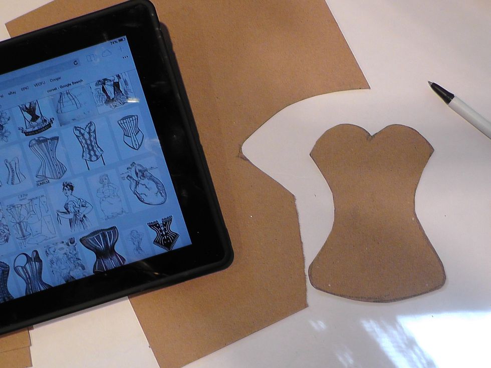 Find a silhouette you like. Do your own free hand trace. I usually have one side I like over the other-so I draw a line through the middle- cut out the side I like and use it to trace the other side