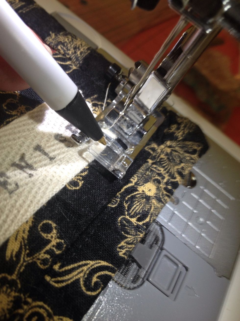 Find a spot on your sewing foot to determine a seam allowance- I am using my center notch, with the needle to the left position