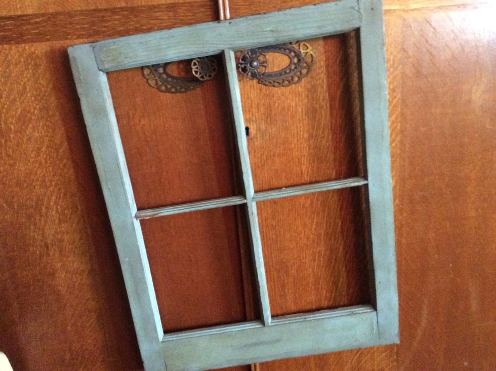 Find an old window frame. Vintage, antique and re-building stores are great sources. You will want to find frames with at least 4 panes. If desired, paint your frame to match your decor.