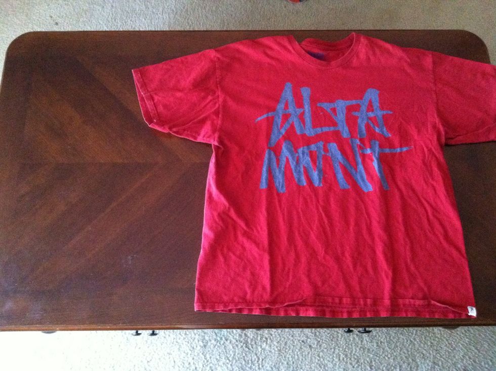 Find and T-shirt and a flat surface.