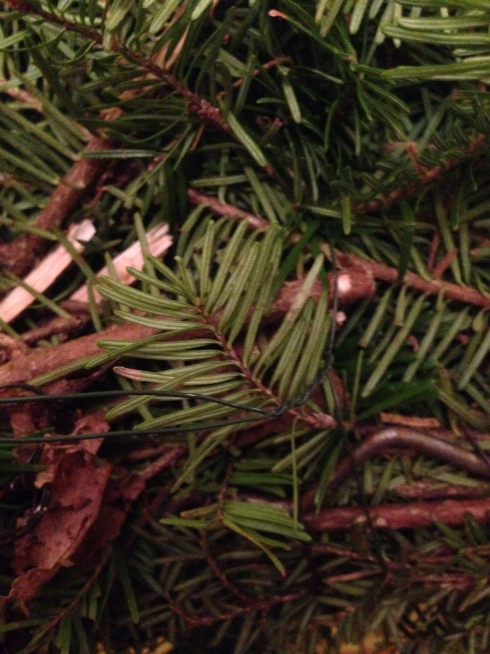 Find and untwist the wire holding the cones and bow in place.