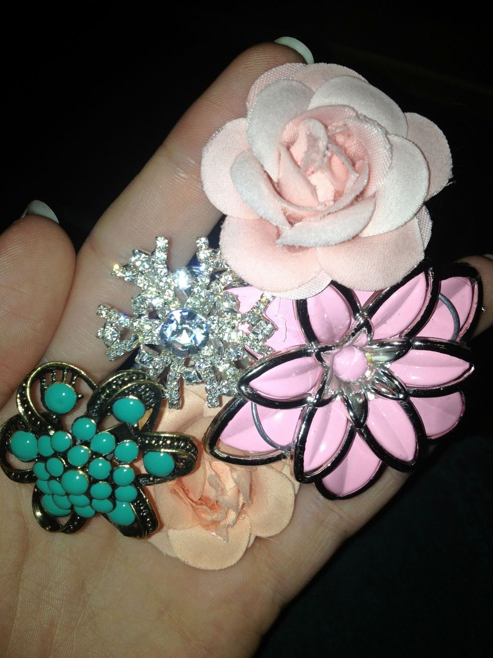 Find earrings broaches and rings that you would like to include in your bouquet .