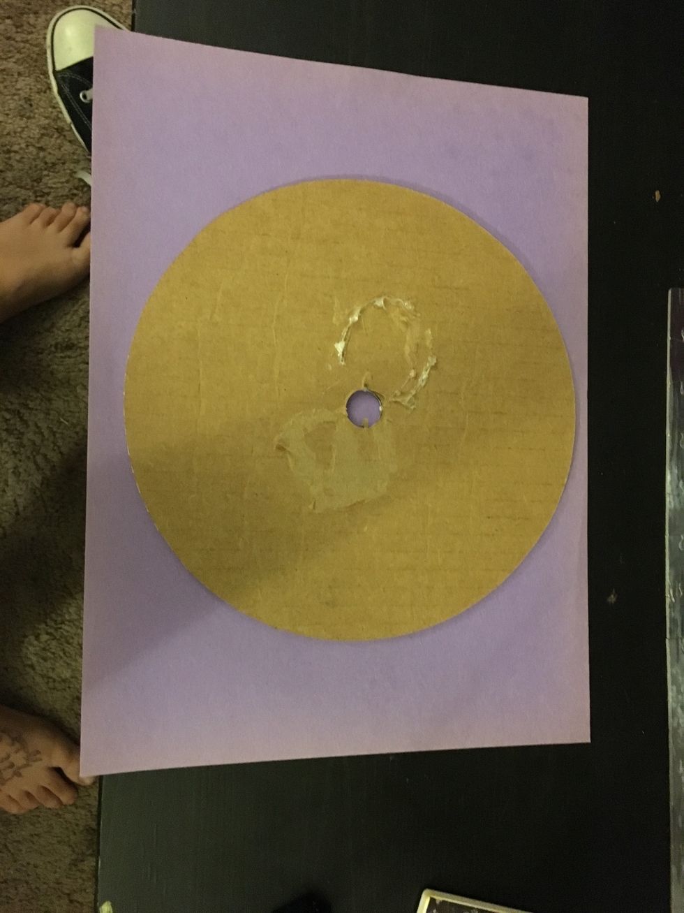 Find something round to trace a circle on the purple construction paper. You may use a compass if you have one.