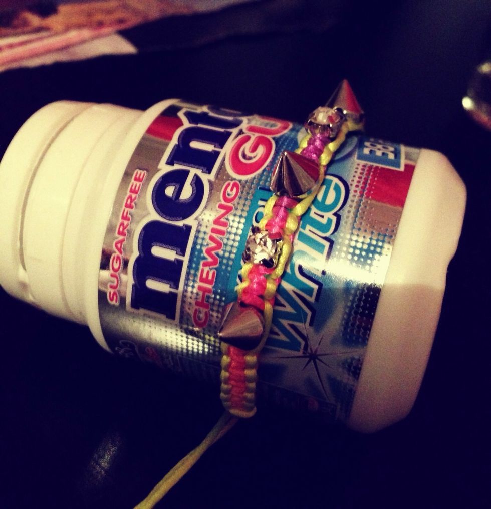 Find something you can hold the bracelet in, so it don't move while applying the top coat.