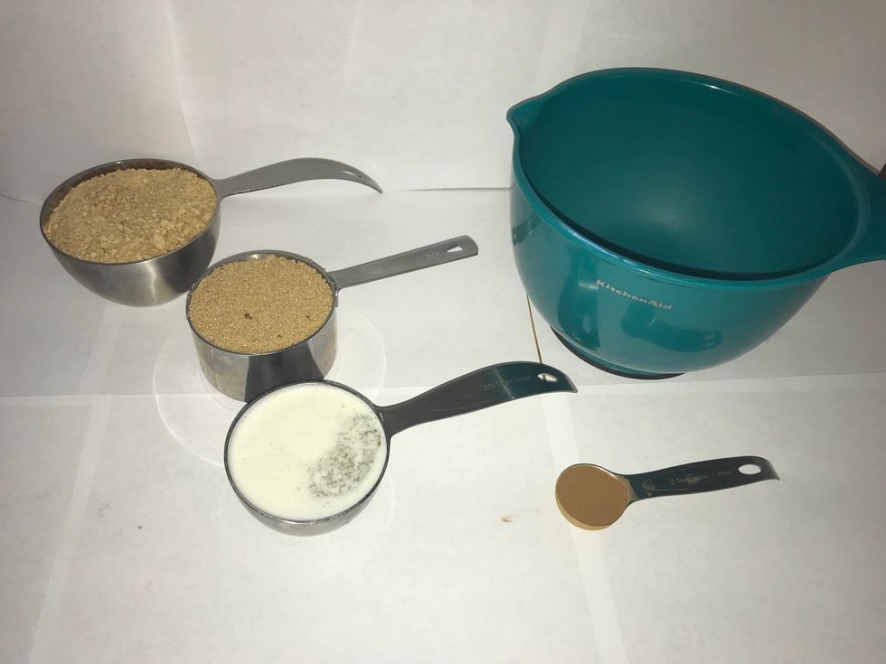 Find streusel ingredients: graham cracker crumbs(1 1/2c), brown sugar(1c), melted butter(2/3c), and cinnamon(2tsp)