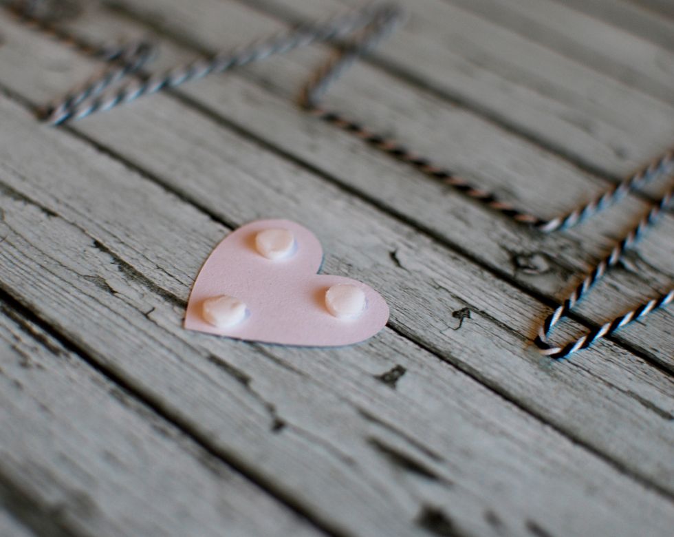 Find the Black heart cut out from the Noteworthy package. Add 3 \u2013 3D Dots to the back.