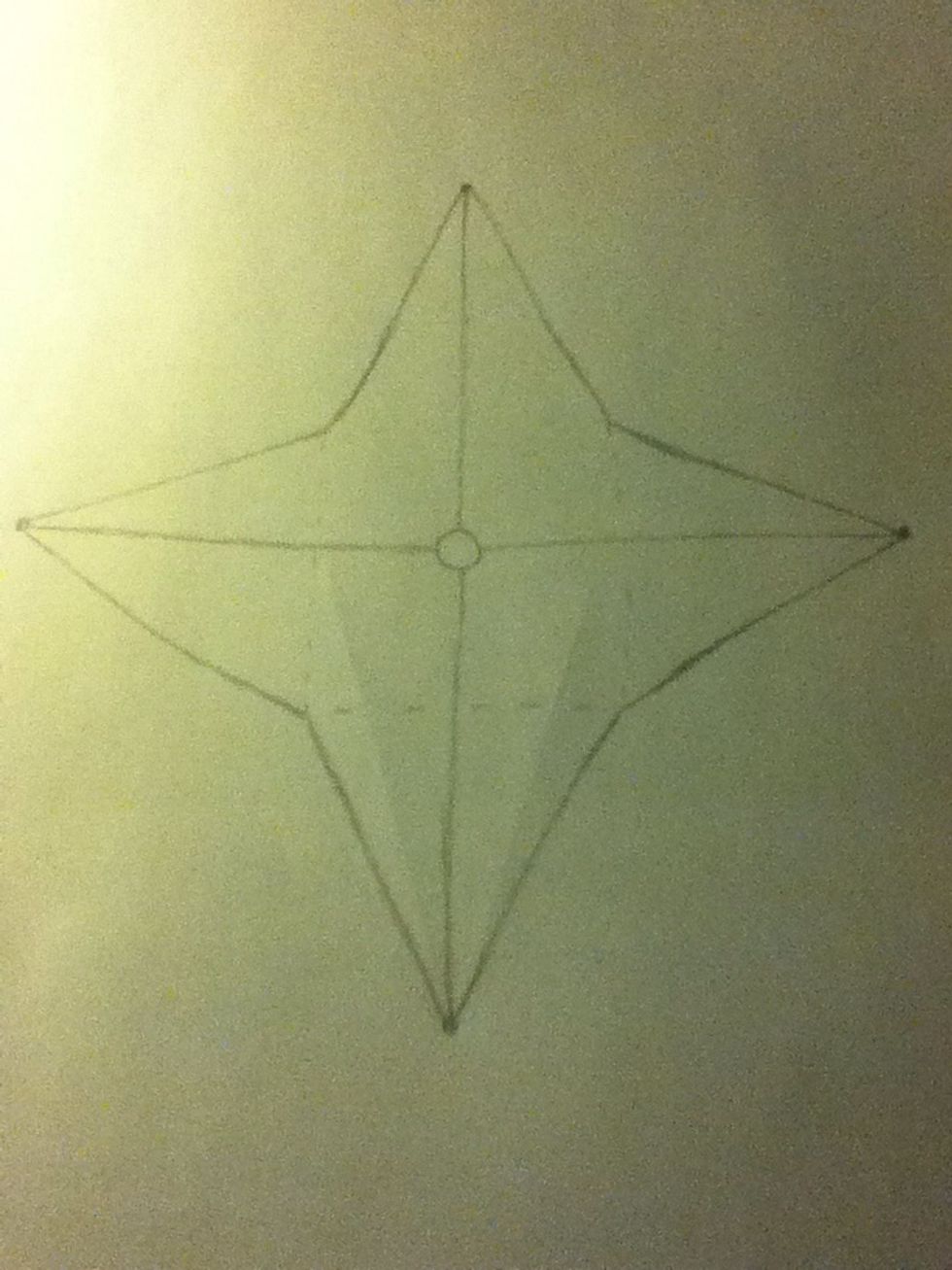 Find the center of the star and draw a small circle. Connect the four points with the circle with four straight lines.