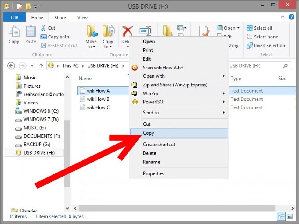 Find the file you would like to copy. Copy and paste onto the flash drive or click and drag over to it.