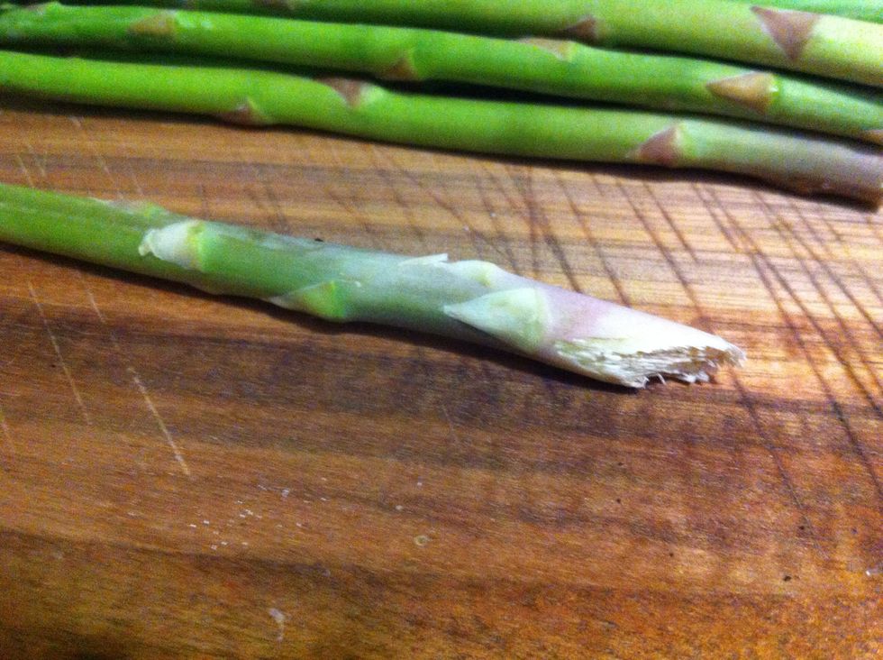 Find the hard end of the asparagus; you should be able to feel where it starts
