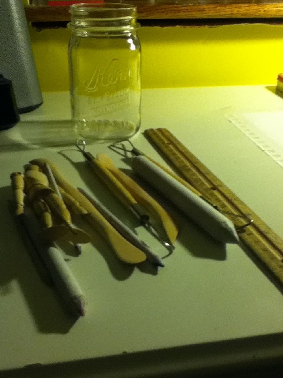 Find the materials you want to put in the bottle. Pencils, rulers, and art supplies are great things to store.