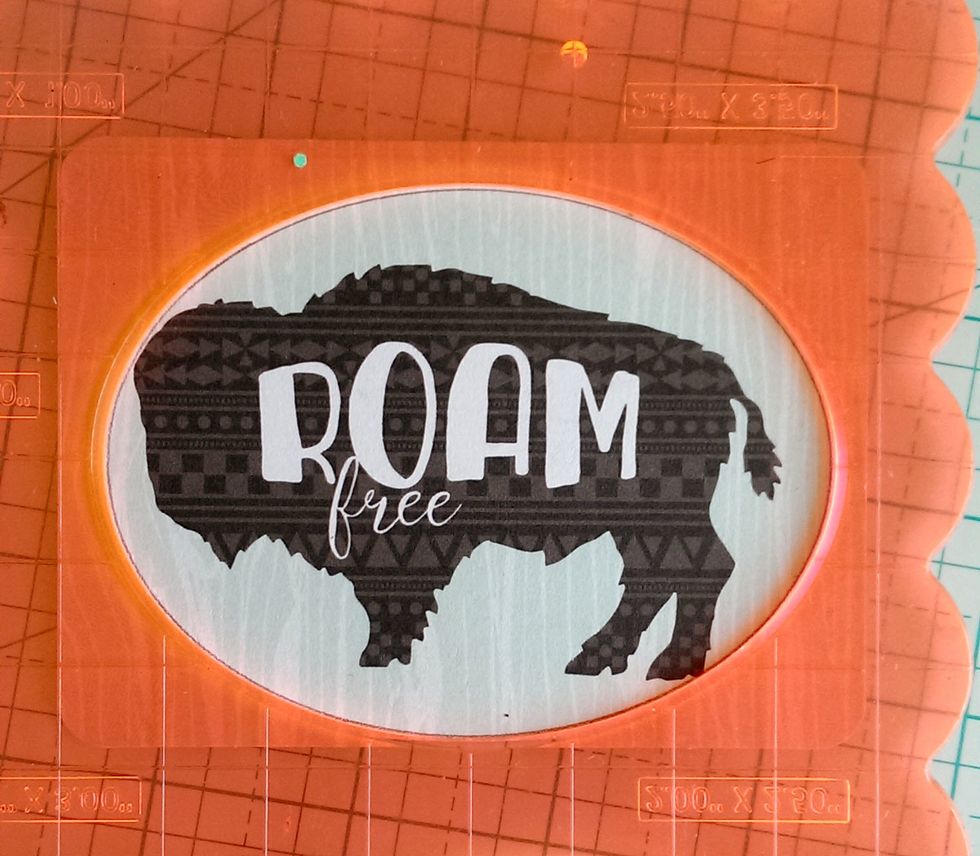 Find this cute Buffalo Journal Card, and trace an oval around the image. Cut it out.