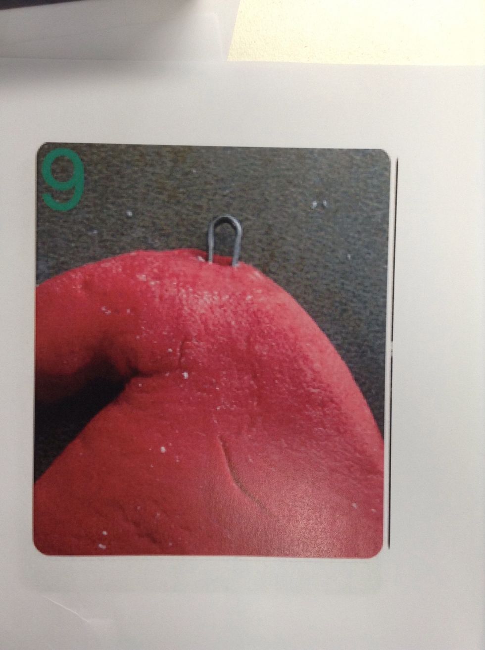 Find yourself a hairpin. Push the hair pin into your hat so the loop is at the top. This will be where you can thread some ribbon through.