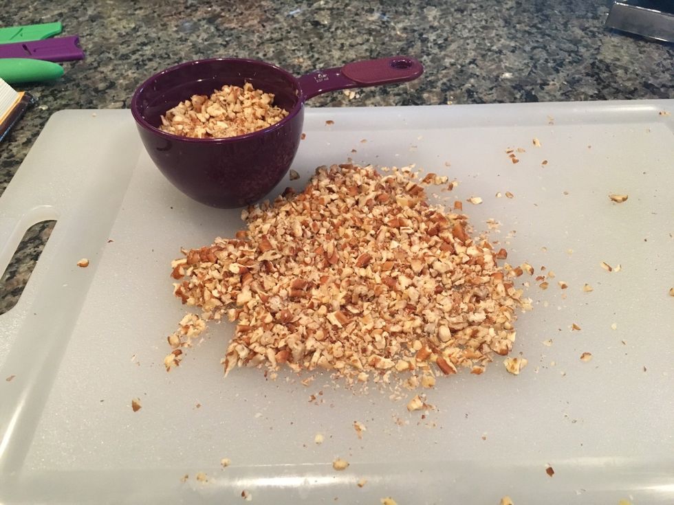 Finely chop 1 cup of pecans. These can be added to the frosting prior to being applied to the cake, but I prefer to add them as a garnish.