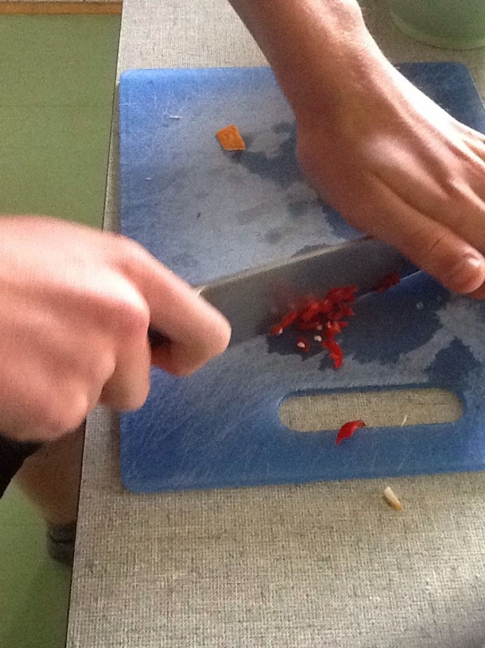 Finely chop a chilli and add to dressing.