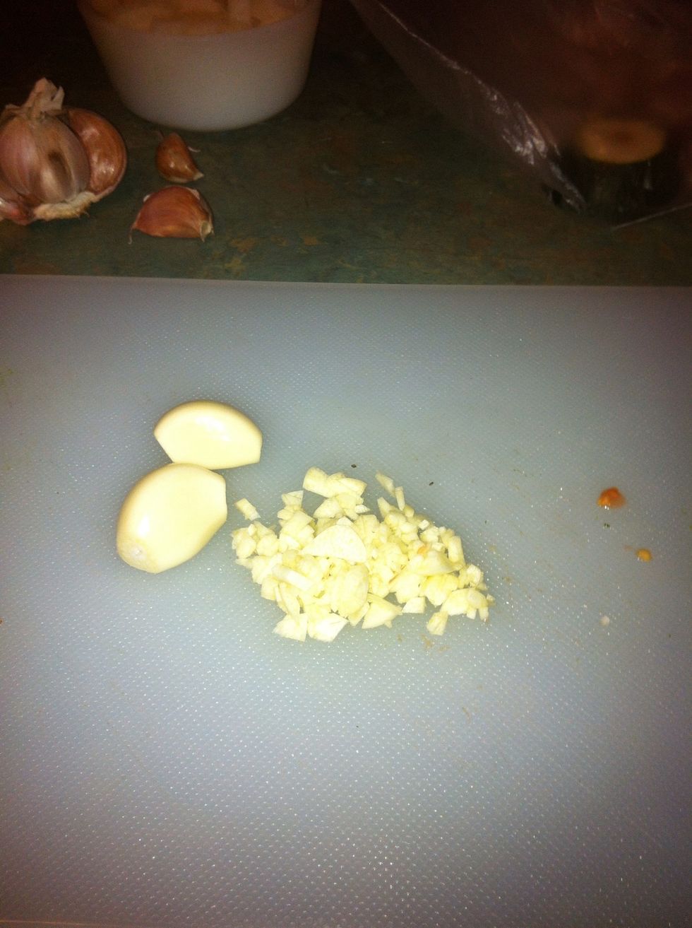 Finely chop garlic. You can crush it if you like but I like to pretend I'm a chef! Add to onion