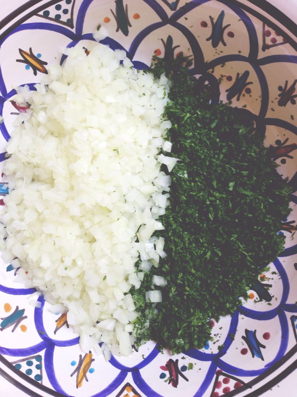 Finely chop one large onion and one cup of parsley and add to mixing bowl. Keep a large pinch of parsley to the side for garnishing.