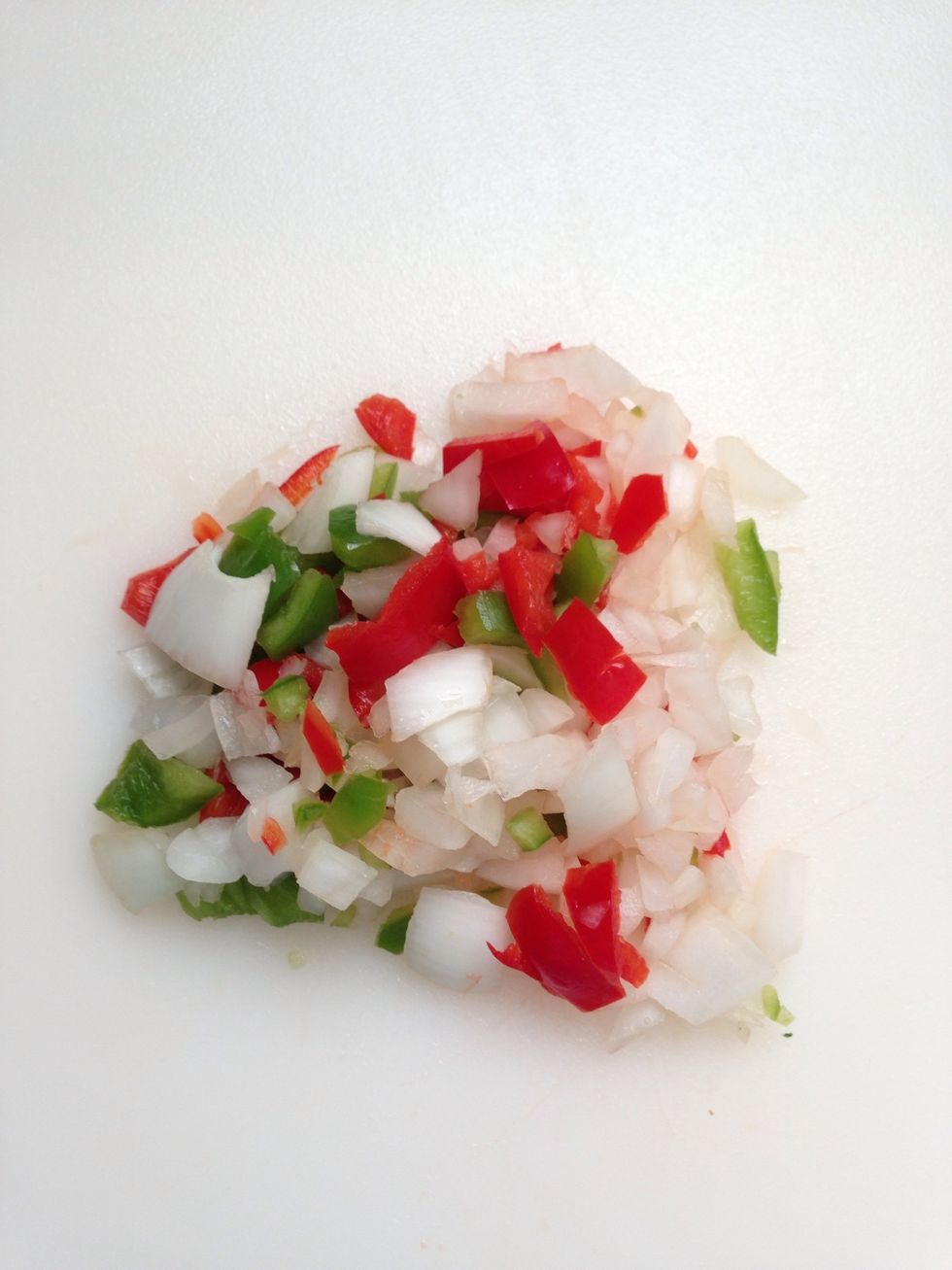 Finely chop onions and peppers. Set tomato aside for later.