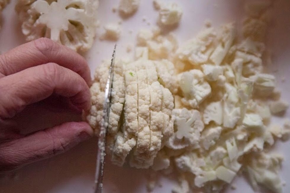 Finely chop the cauliflower florets and set them aside.