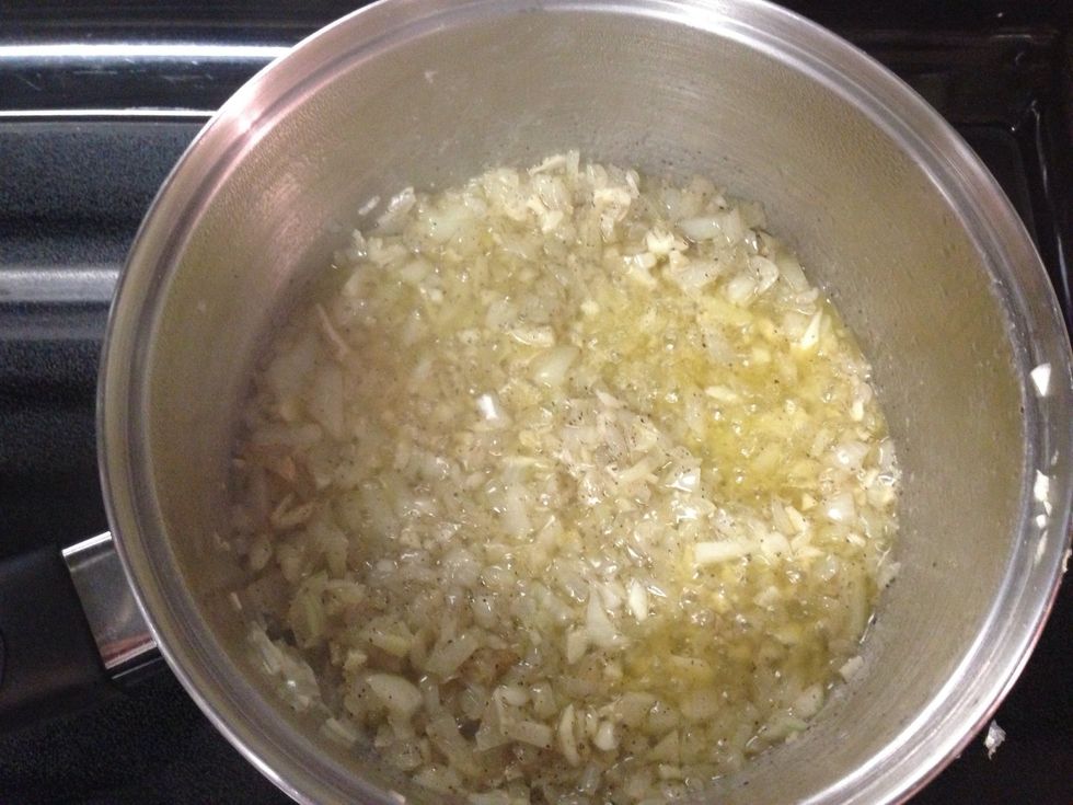 Finely chop the onion and garlic. Put into a sauce pan with the butter. Saut\u00e9 until the garlic and onion are translucent (about 10 minutes).
