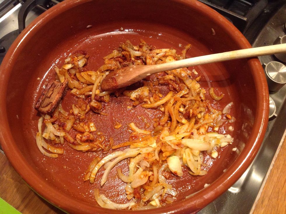 Finely chop the onions and fry in olive oil over a low heat until softened and a little coloured.  Add in the spices and garlic and stir through for a minute, ensuring you don't burn them.