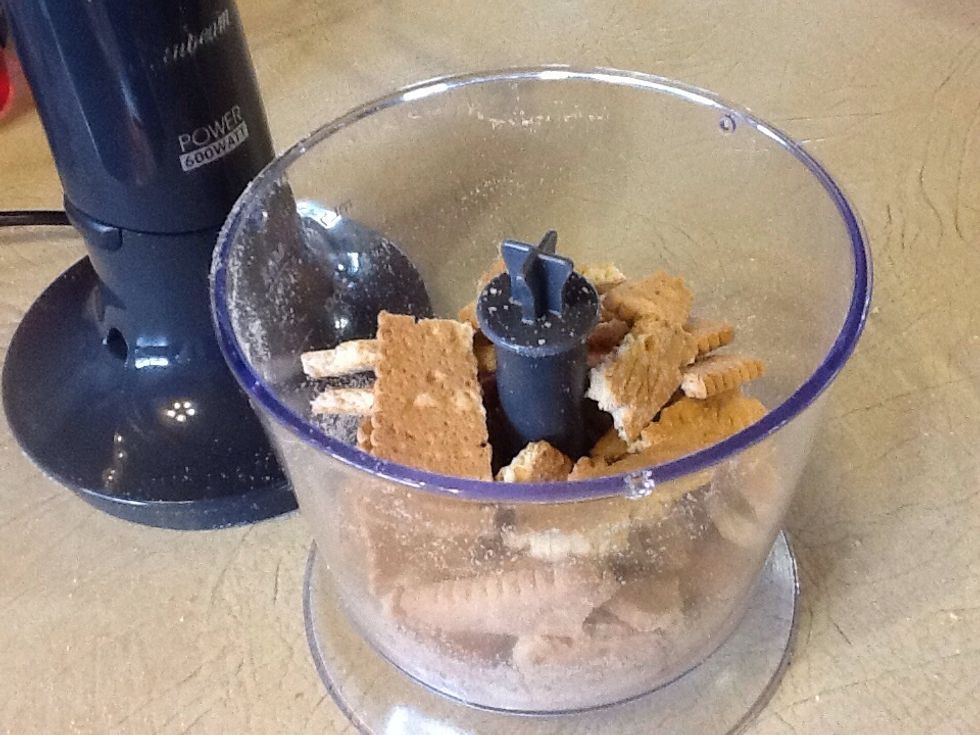 Finely crush the biscuits using a blender or food processor.