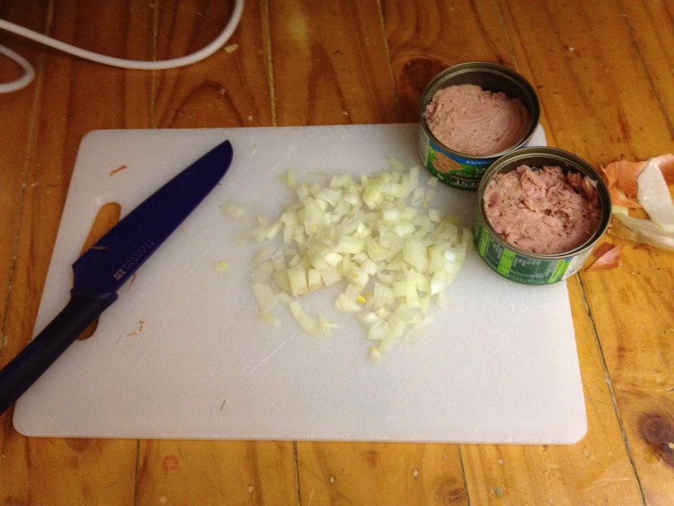 Finely dice half a brown onion and drain the cans of tuna.