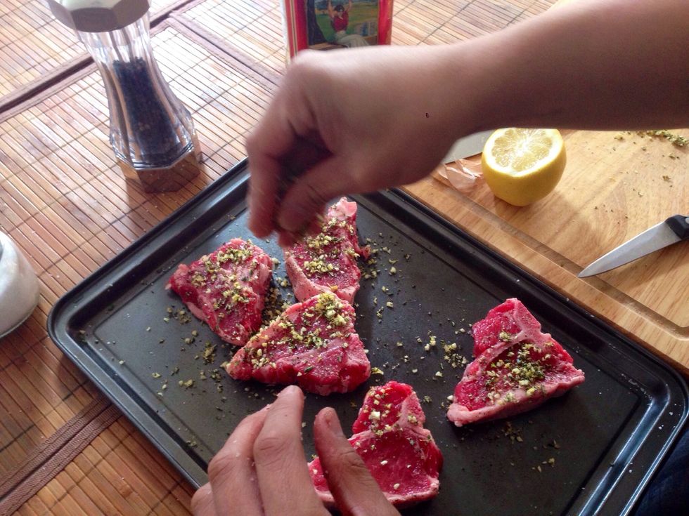 Finely dice your garlic, lemon zest and rosemary into a bowl and combine with salt and pepper.