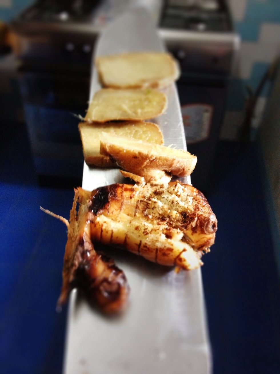 Finely sliced 3 cm of fresh ginger, 4 cm galangal (crushed). Also wash and pat dry: 5-6 kaffir lime leaves, 2-3 Bay leaves and 2 stalks of lemongrass