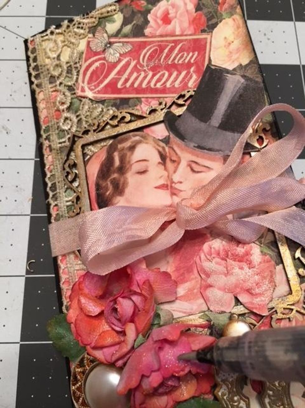 Finish by painting the roses and various elements on the cover and inside the booklet with clear Wink of Stella Brush pen to add some shimmer and sparkle.