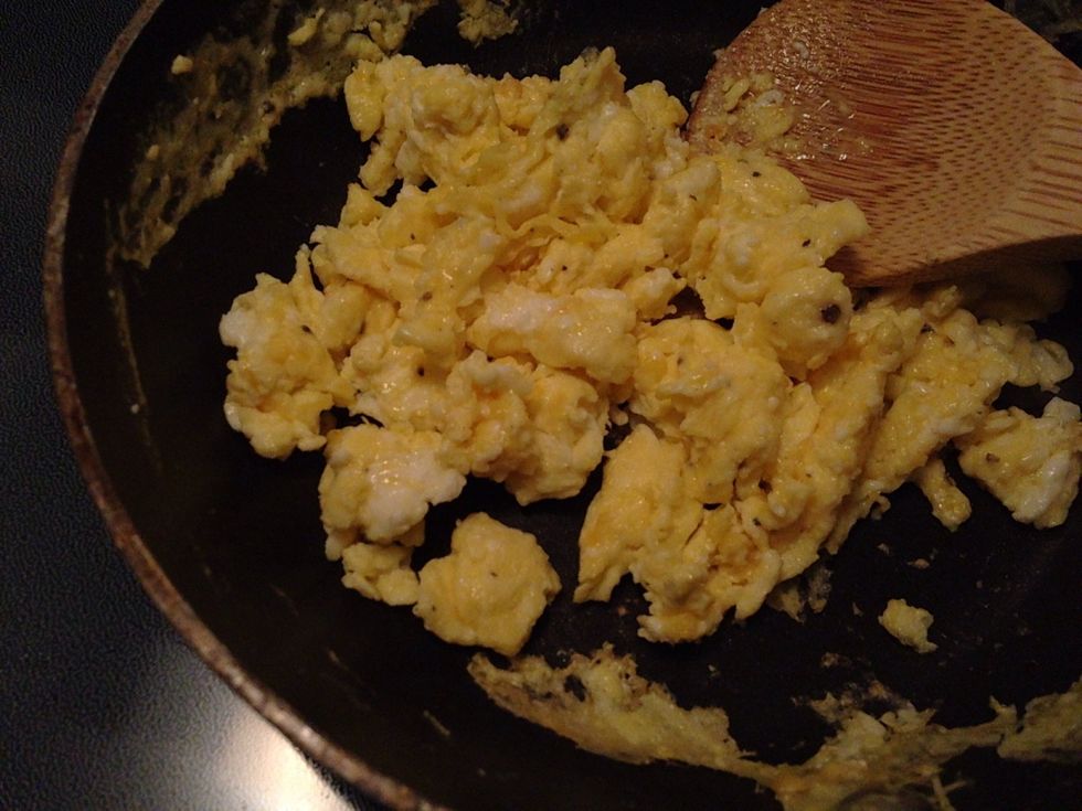 Finish cooking eggs and cheese is melted