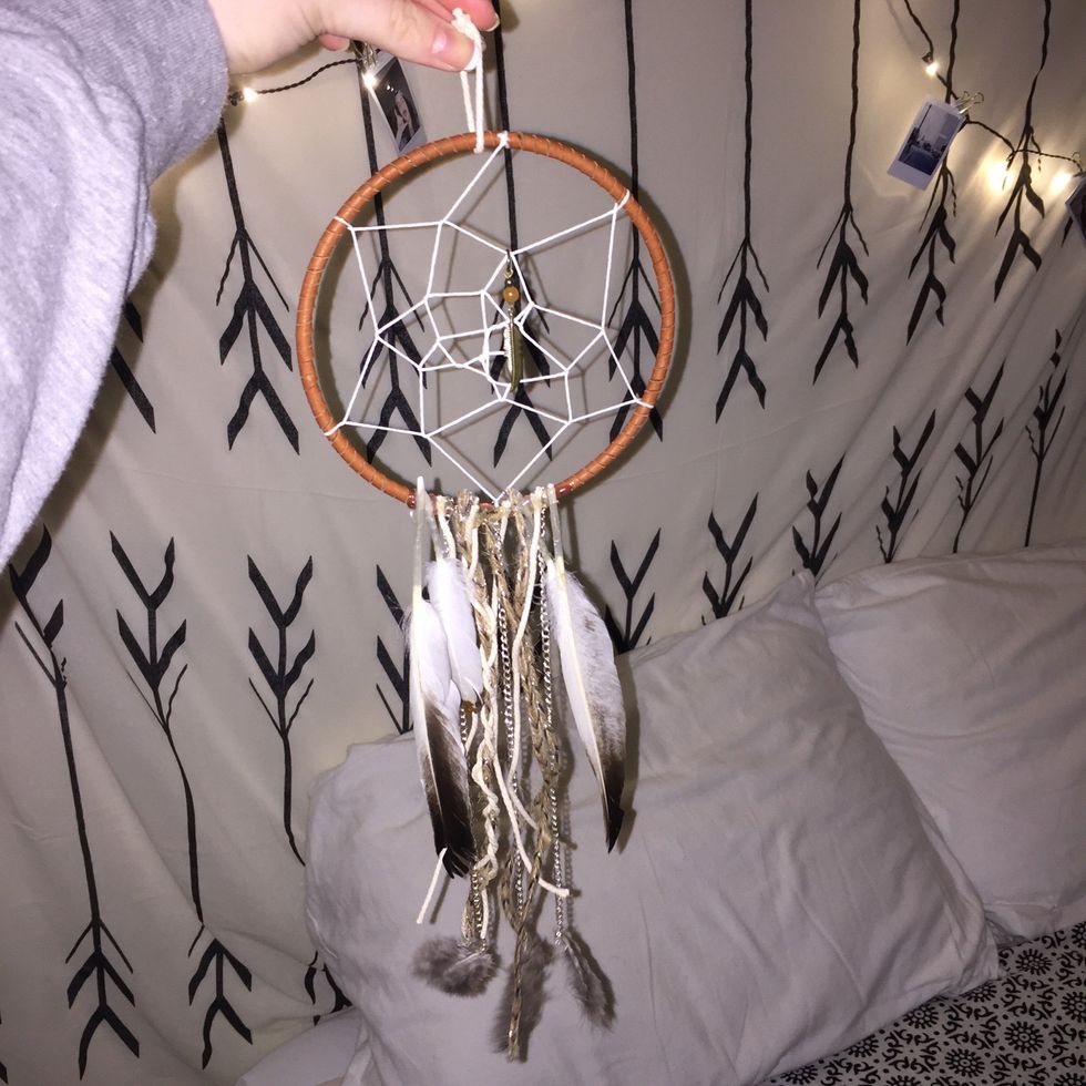 Finish gluing everything on until you are happy with your dream catcher.