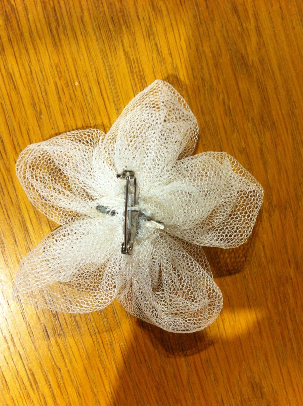 Finish off by securing a bobby pin, brooch pin or a hair clip.