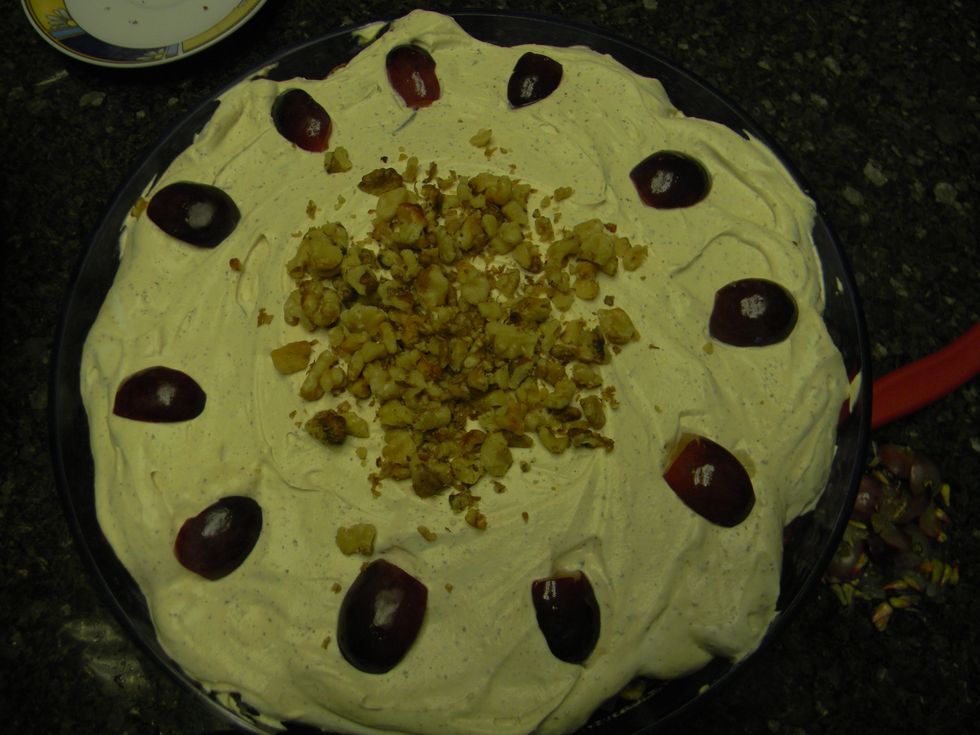 Finish off with a layer of cream and decorate with leftover fruit and nuts.