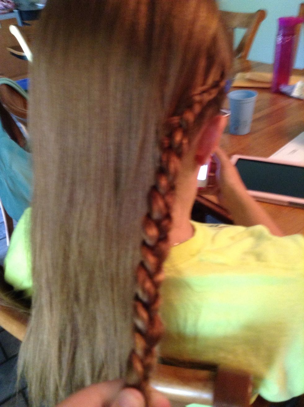 Finish out the braid to the bottom of the hair and put a small ponytail in it to hold it there.