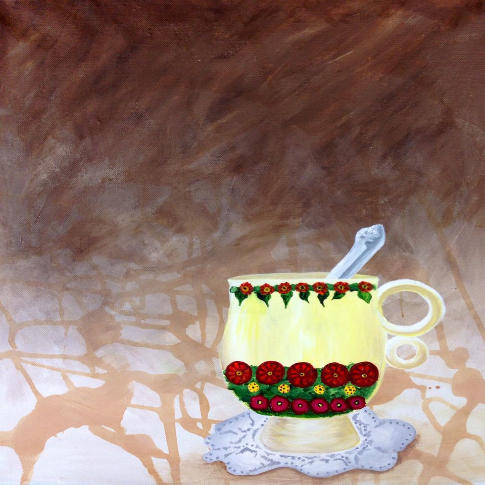 Finish painting the flowers and add details so you are satisfied with the teacup.  Also add a shadow underneath the tea cup in order for the teacup to appear three dimensional.