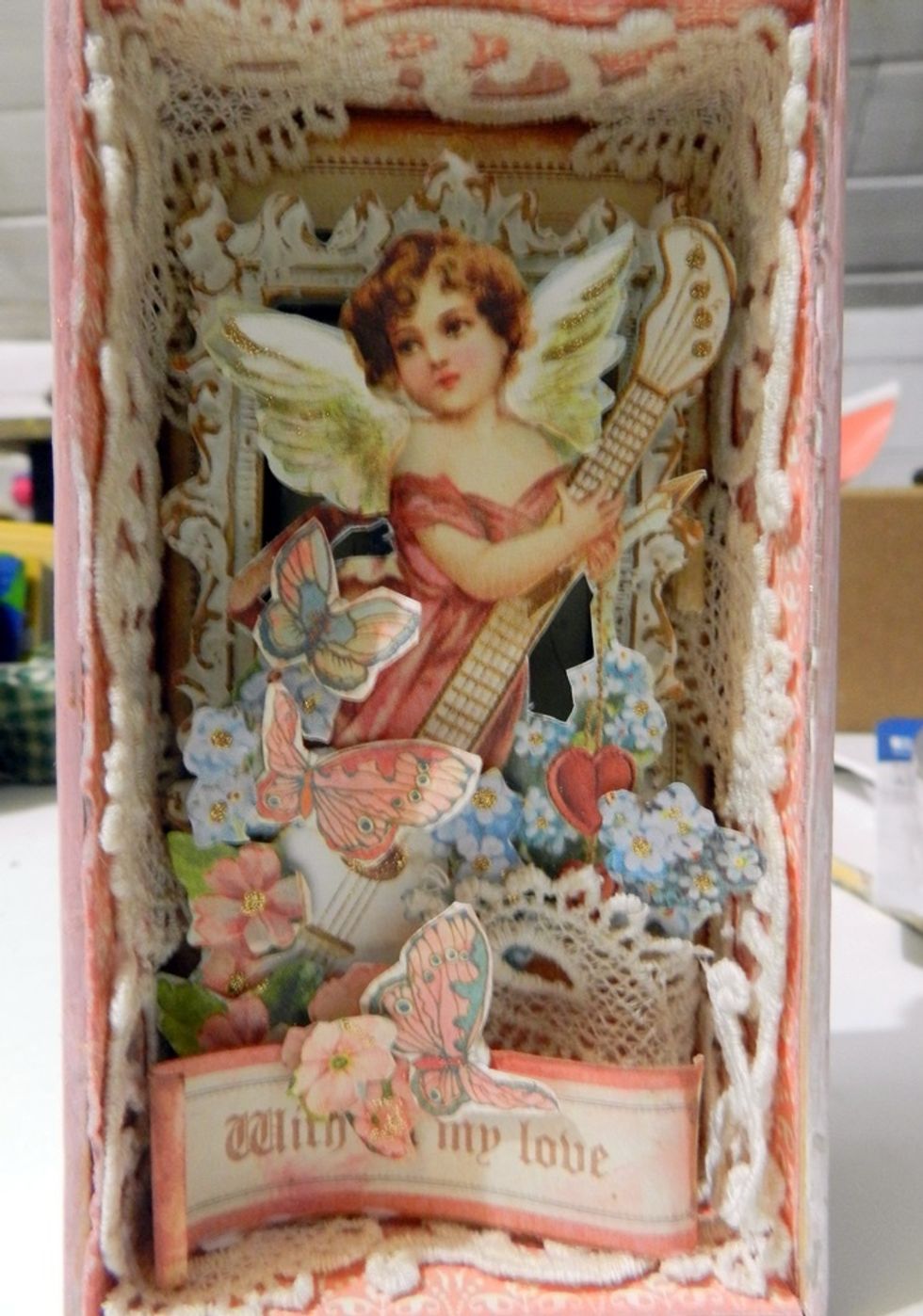 Finish putting the label at the bottom and adding some butterflies.