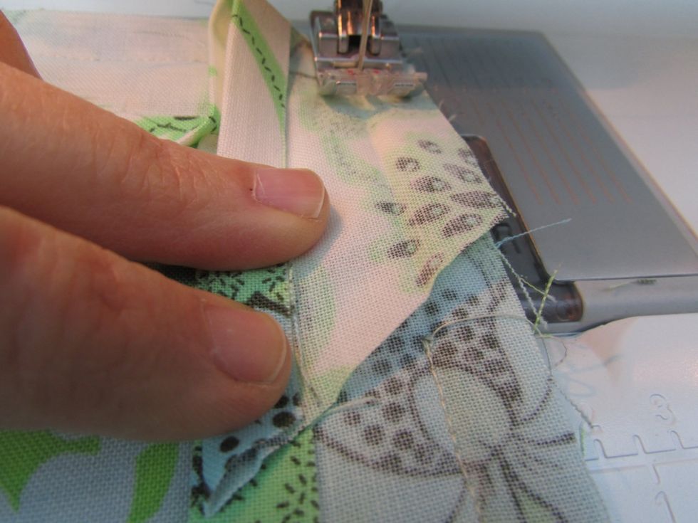 Finish sewing across to secure.