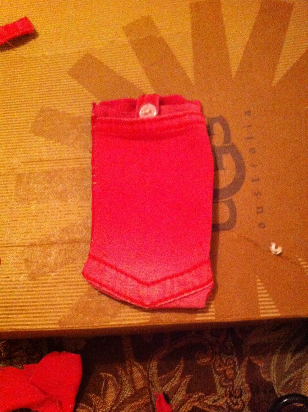 Finish stitching, flip right side in and voila. I added a latch so my phone won't fall out. So you have a phone compartment and a pocket to put cards or whatever else in.