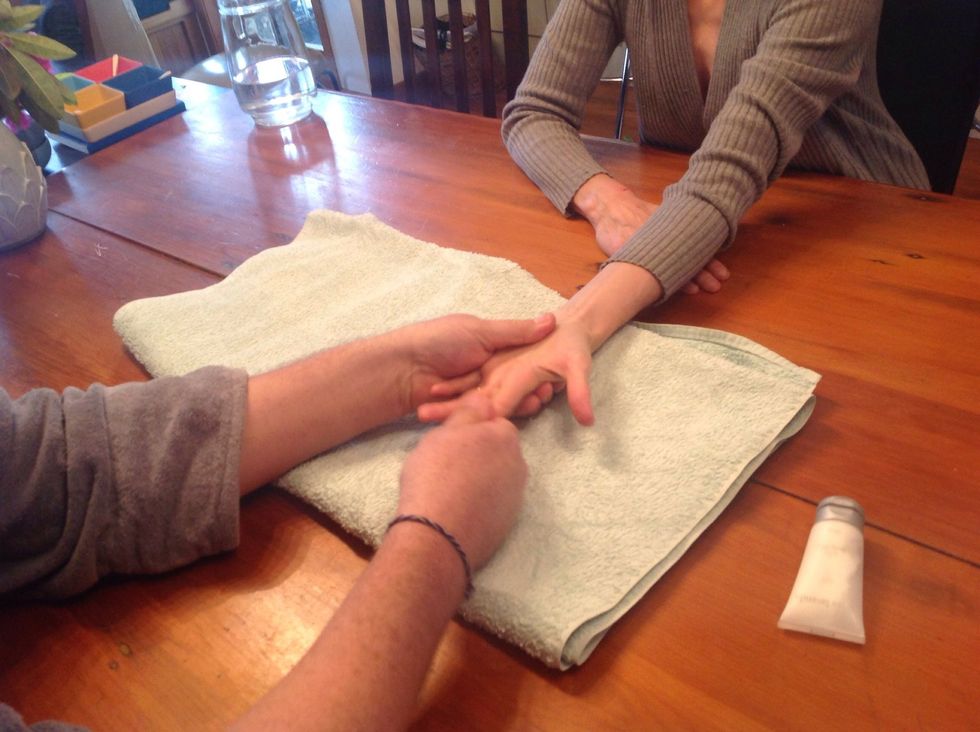 Finish technique by stroking down to end of fingers.