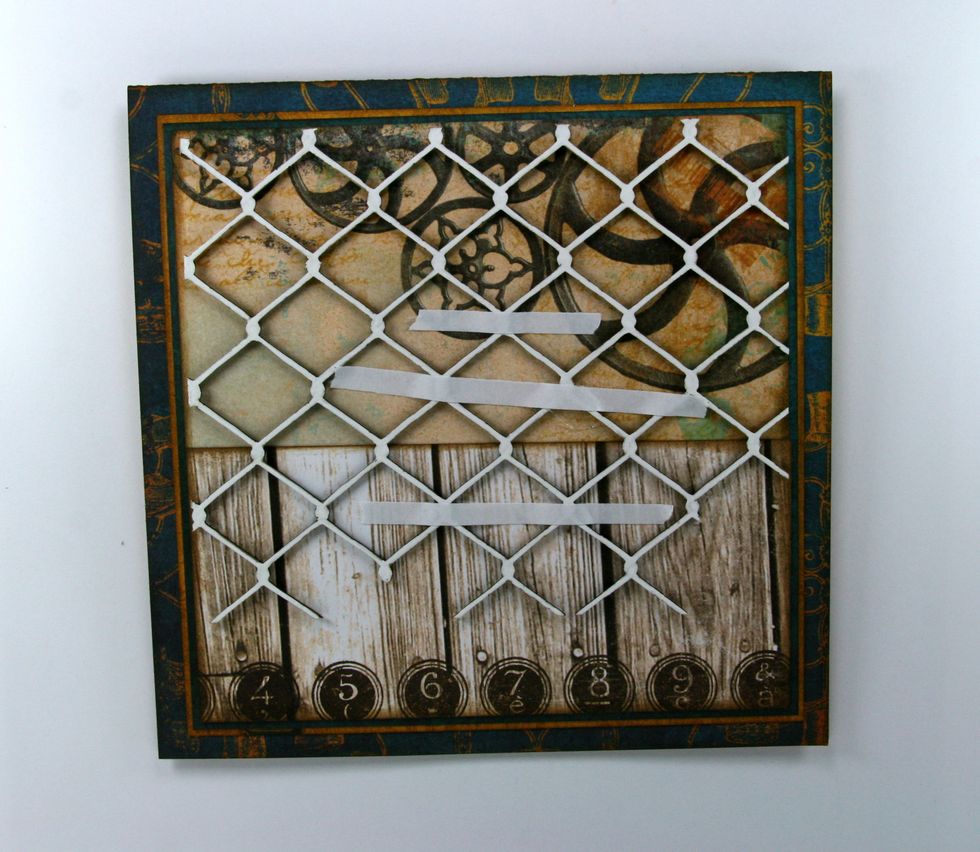 Finish the Chain Link Chipboard with white gel pen. Allow to dry and attach to base.