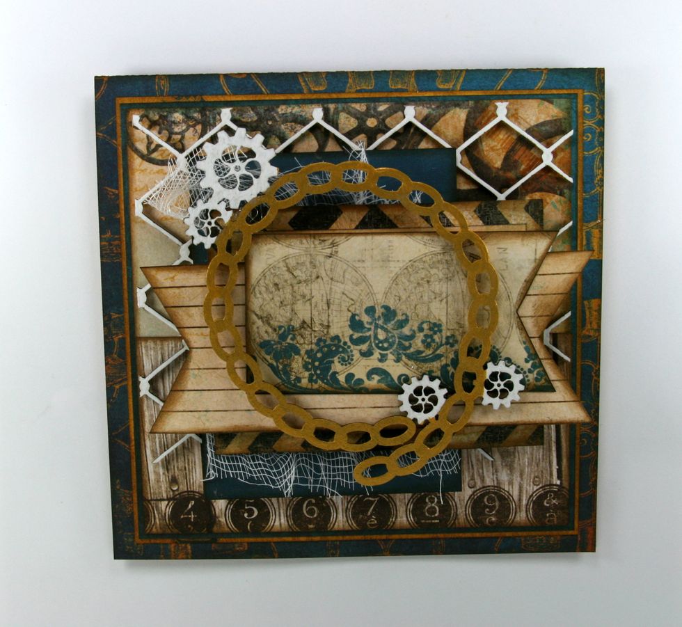 Finish the Chain Link Frame with gold paint and white gel pen. Allow to dry and attach using hot glue.