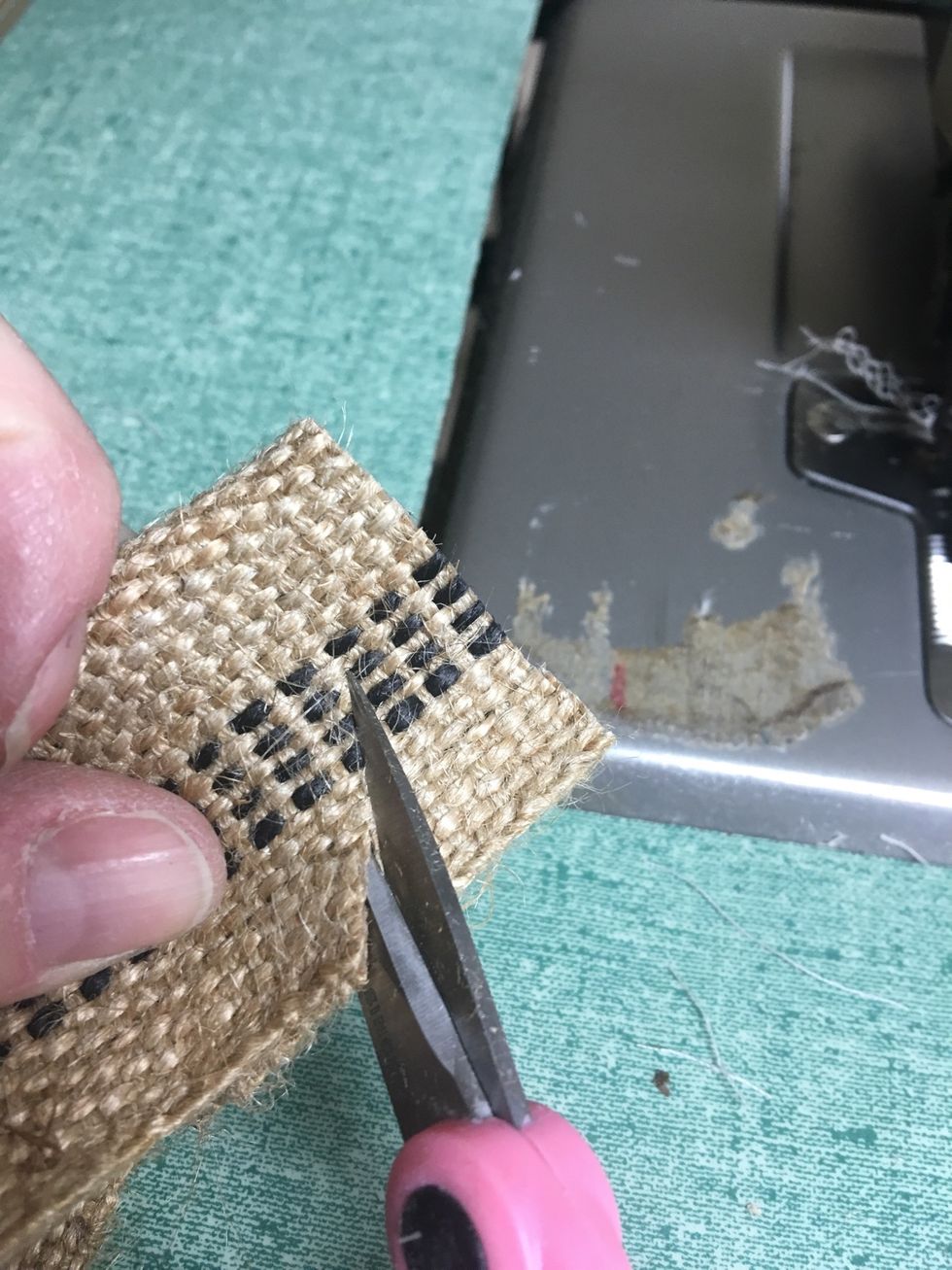 Finish the raw top ends by folding the banding in half right sides together.  Clip the corners at an angle from the outside edge to the middle fold.