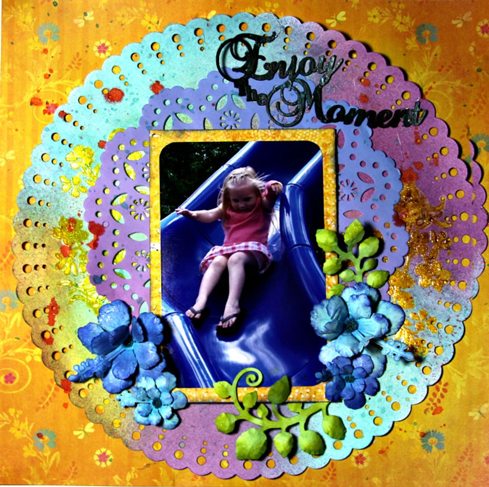 Finish up your layout by adding the photo, hand made flowers and chipboard title.