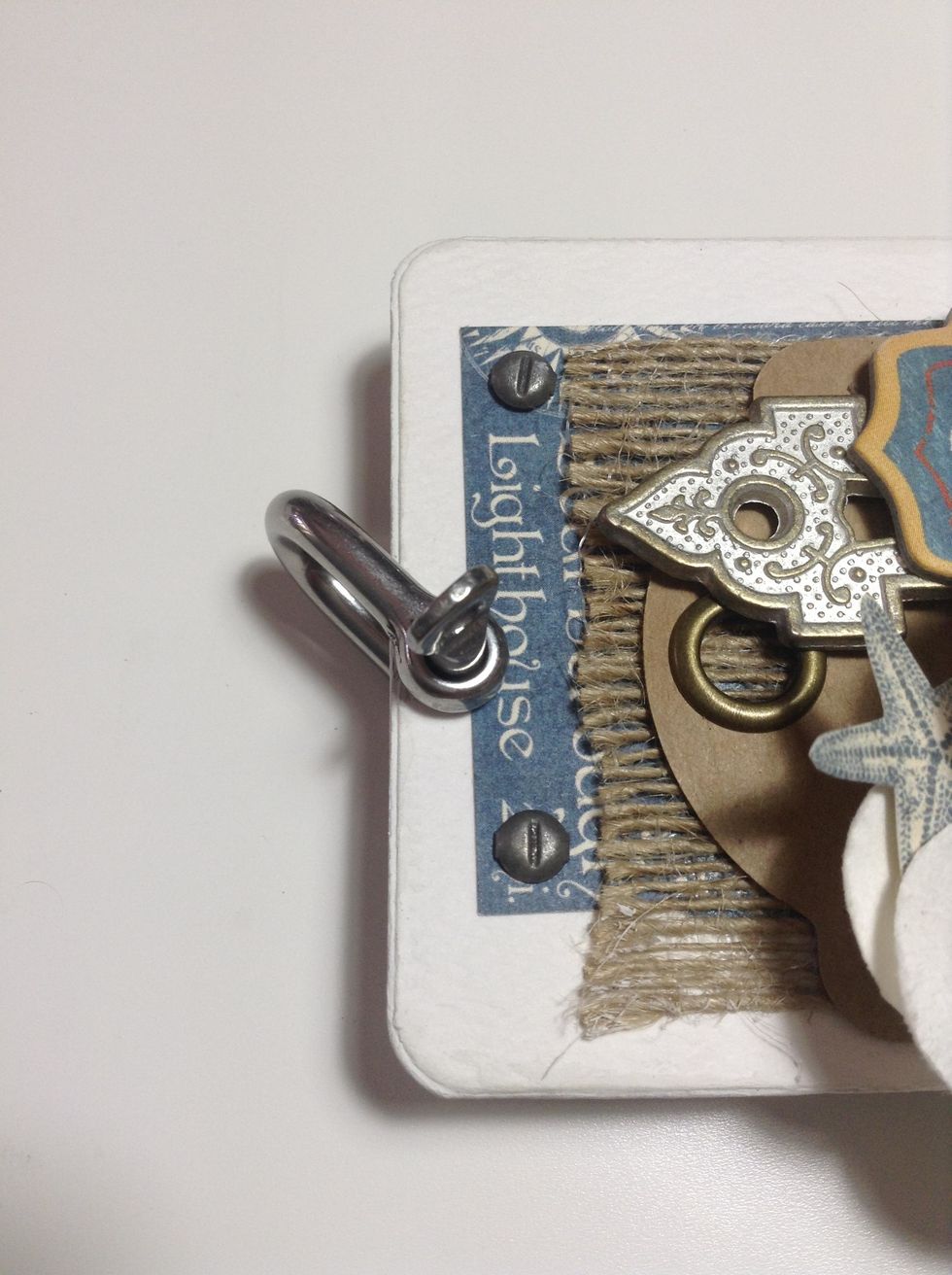 Finish your mini album with a binder ring, I have use a metal ship shackle...