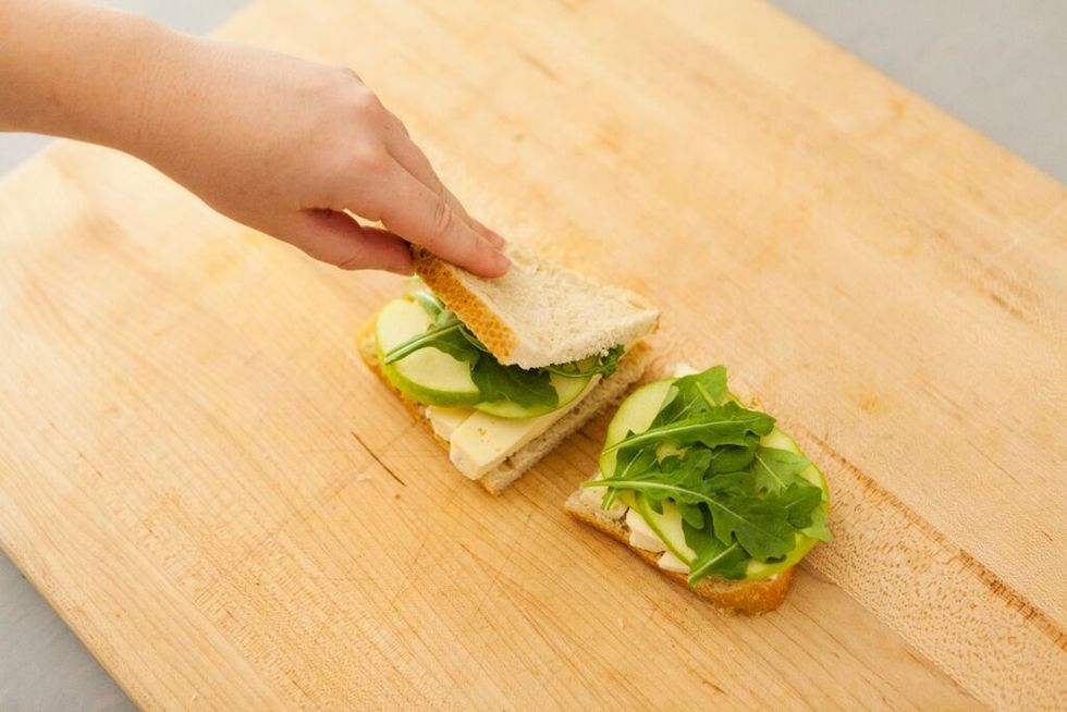 Finish your sandwiches with another layer of sourdough bread.