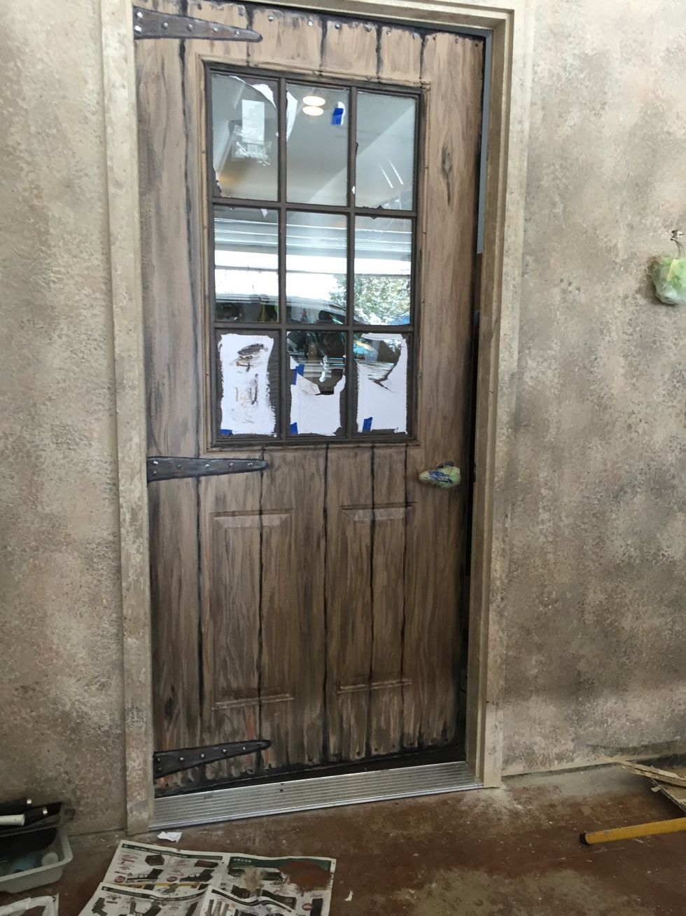 Finished Door. I used some of the black/brown paint to make the door appear to have a space at top & bottom. I wanted it to appear to be an old, massive creaking door.