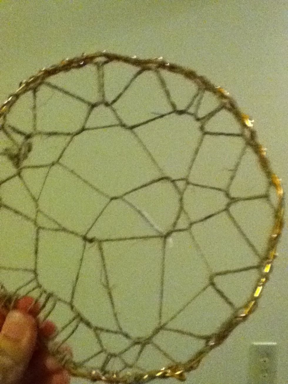 Finished product. Most dreamcatchers vary on the maker, type of string, and how intricate you wanna be. Don't fret if it's not identical to this. So long as it's the idea of it, you'll be fine.